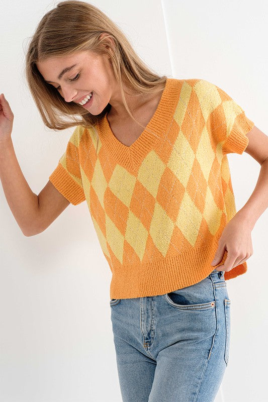 Closeup view of Orange Triangle Sweater